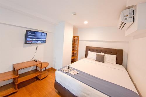 Tangerang Apartment | Cozy Stay and Comfy Studio Loft Kingland Avenue Apartment By Travelio