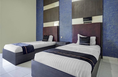 Palembang Hotel | Hotel O near Universitas Widya Dharma