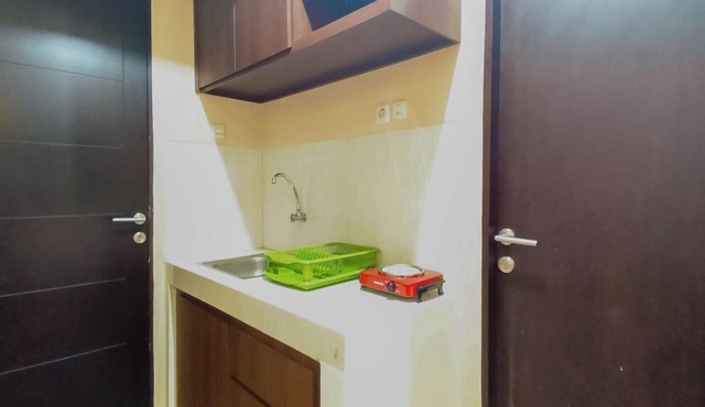 Bright Woody Vibes Studio Room At Suncity Residence Apartment in Sidoarjo