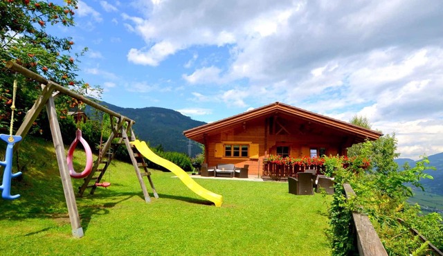 Chalet directly at the snow-covered and lighted downhill in Kaltenbach