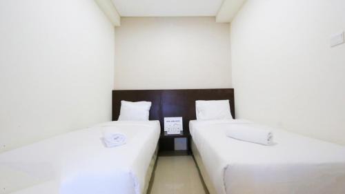Clean and Cozy 2BR Apartment Parahyangan Residence By Travelio in Bandung