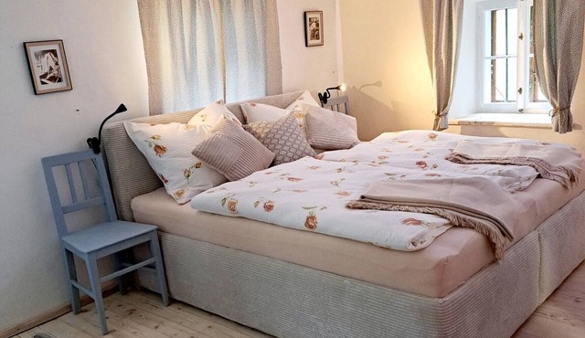 Compact vacation apartment (36 m2) in a secluded location with fireplace, terrace & stream access in Gaming