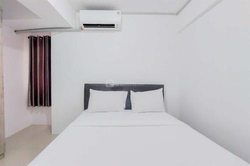 Homey and Comfort Living 2BR Urbantown Serpong Apartment By Travelio in Tangerang