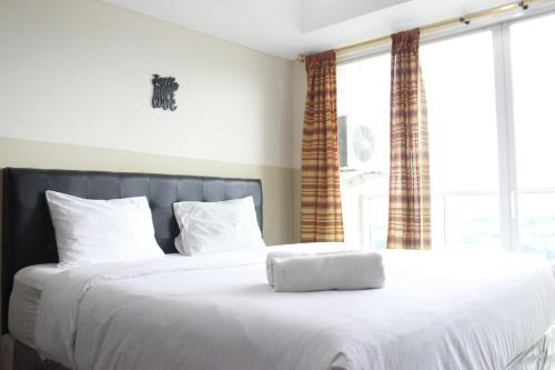 Modern Studio Room at Tamansari La Grande Apartment By Travelio in Bandung