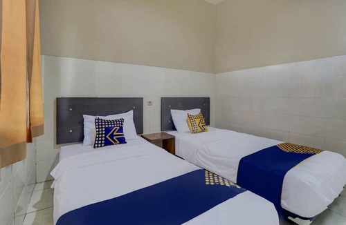 Muncar Hotel | OYO Life 90159 Puri Asoka Guest House
