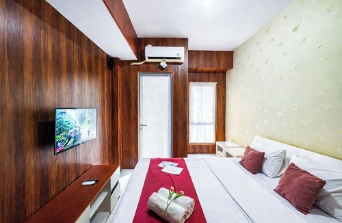 Sidoarjo Apartment | Wood Accents Studio At Tamansari Prospero Sidoarjo Apartment