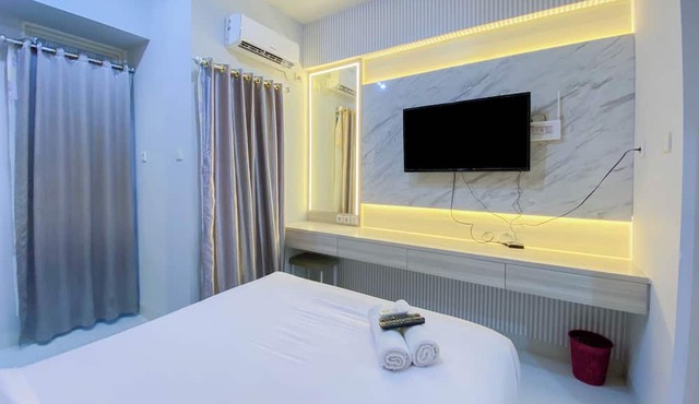 Nice And Cozy Studio At Amartha View Apartment