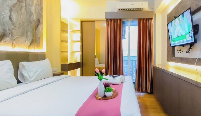 Clean And Neat Deluxe Studio At Suncity Residence Apartment in Sidoarjo