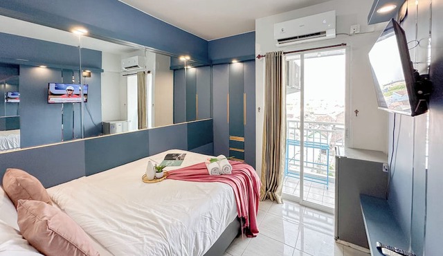 Restful Blue Studio At Suncity Residence in Sidoarjo
