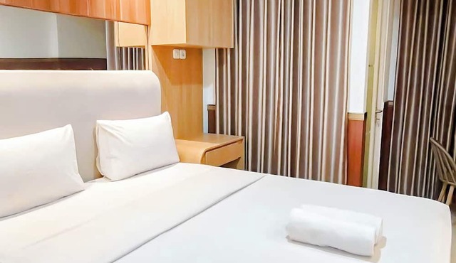 Wooden Touch Studio At Tamansari Skylounge Makassar Apartment